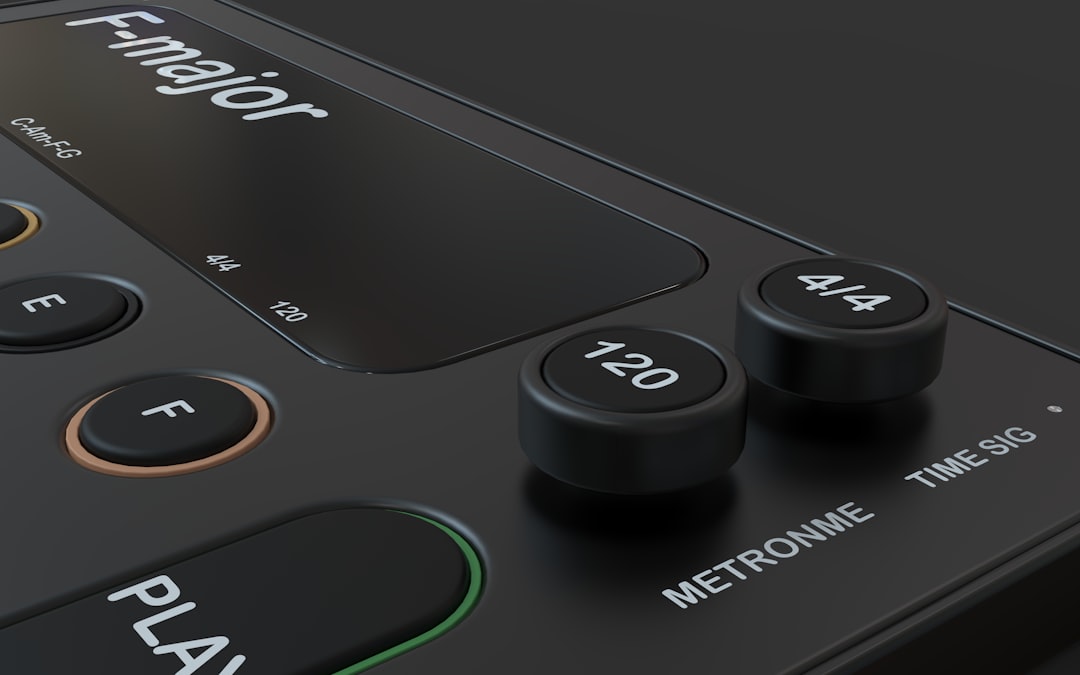 Close-up of a digital metronome with tempo settings.