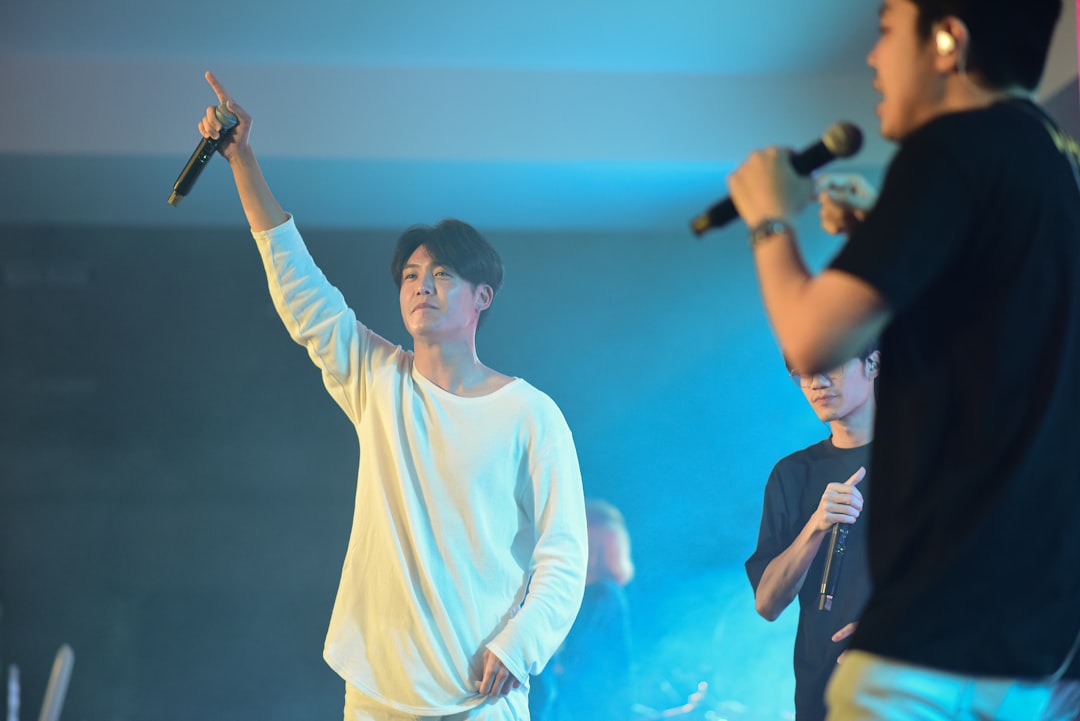 A group of young men standing on top of a stage