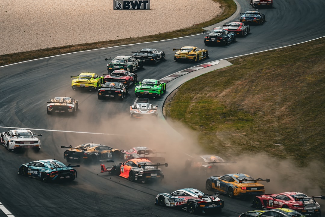 Race cars speed around a track.