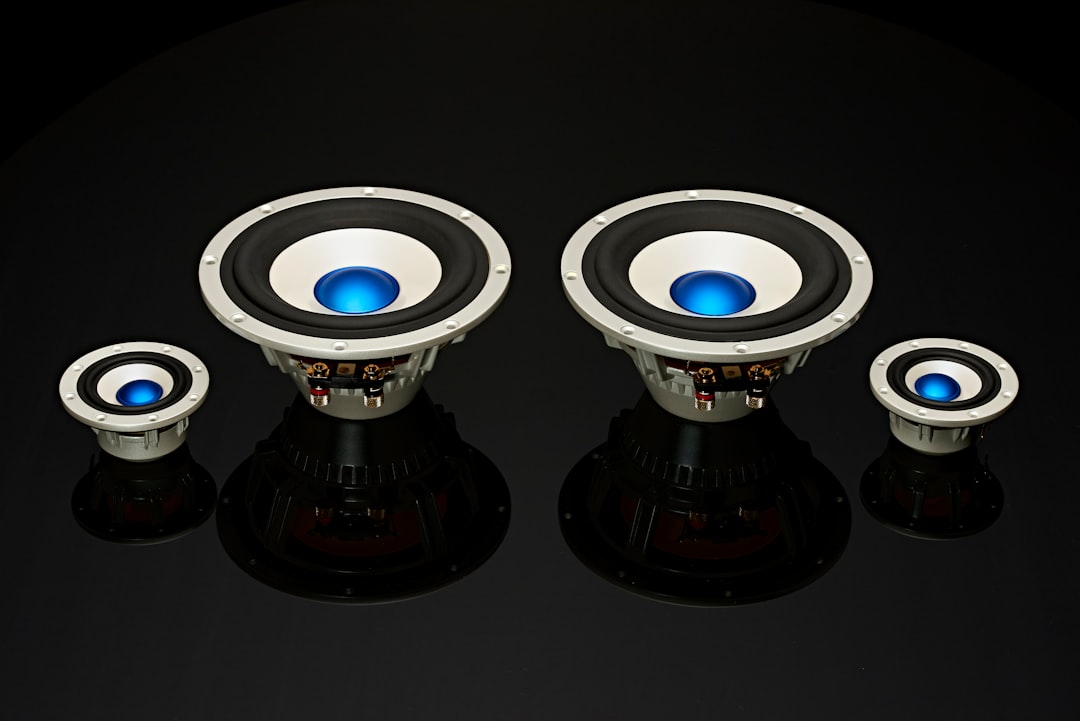 a pair of speakers sitting on top of a table