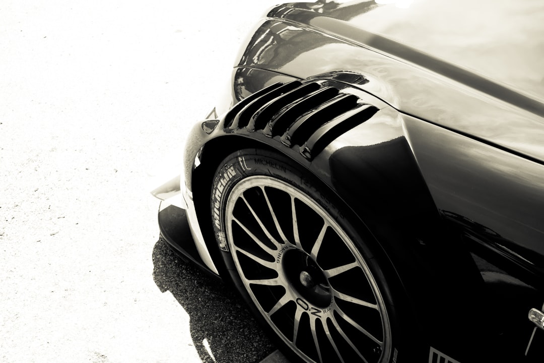 a black sports car parked on the side of the road